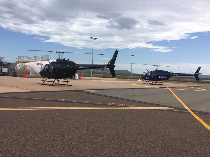 Photograph of two helicopters parked at Port Augusta Airport courtesy of Shane Herman