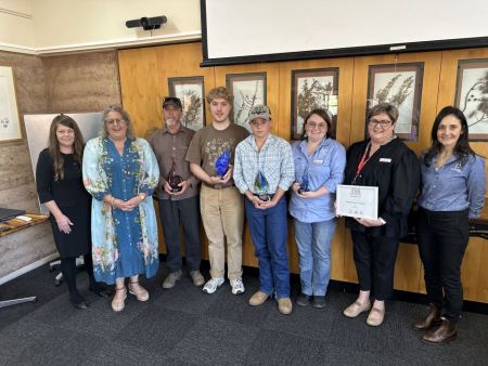 Group photo from the award function with Port Augusta City Council Arts Officer Christie Mitchell, Mayor Linley Shine, Grand Prize Winner Hugh Avey, Peoples Choice Winner Jasper Goldney, Youth Winer Axel Klem, School of the Air Staff Rebecca Morley and Angela Grindell, and Danielle Davis from sponsor Potentia Energy